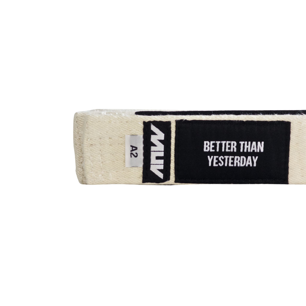 MUV Relic White purple hemp BJJ belt with "Better Than Yesterday" label and black rank sleeve